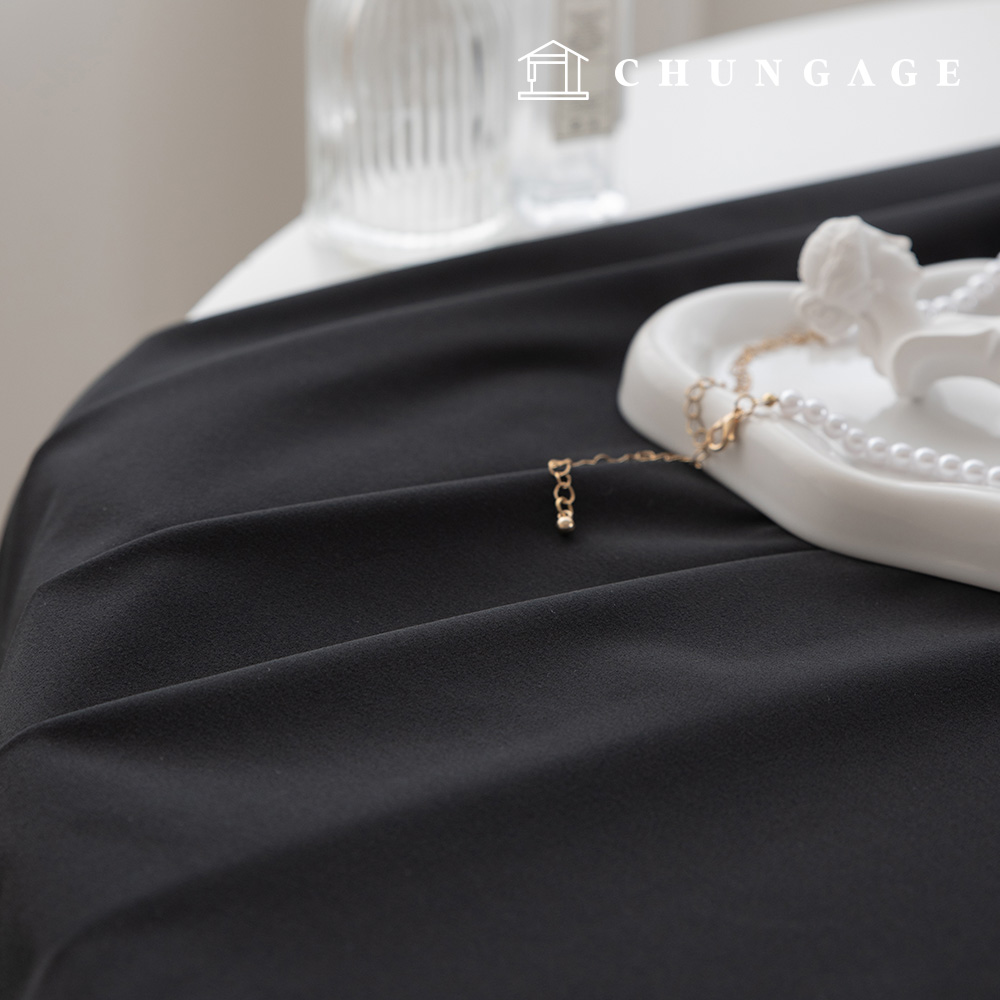 黑色純色聚酯纖維四向彈性布料，純黑色